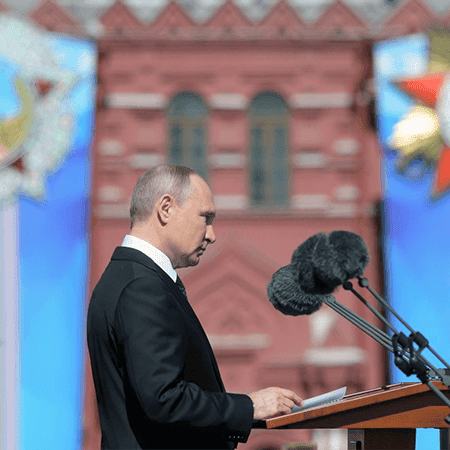 Image of President Vladimir Putin speaking at a podium.