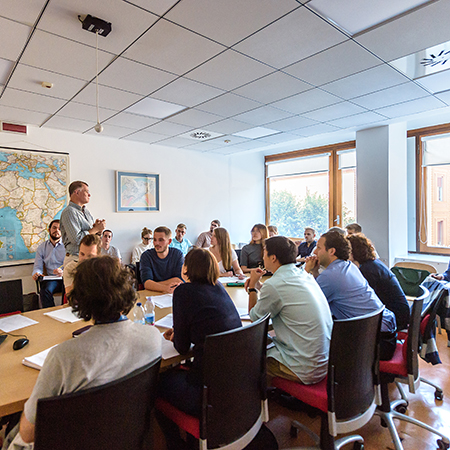 Johns Hopkins SAIS students listening to a class lecture