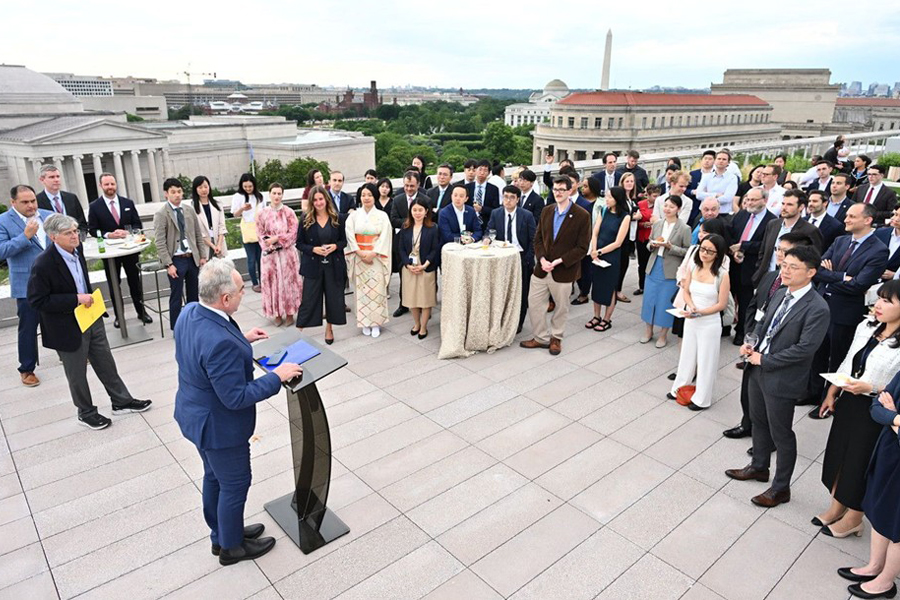 Fellows participate in an opening reception at the Hopkins Bloomberg Center