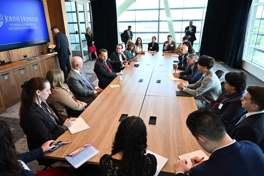 students and faculty setting at a roundtable event