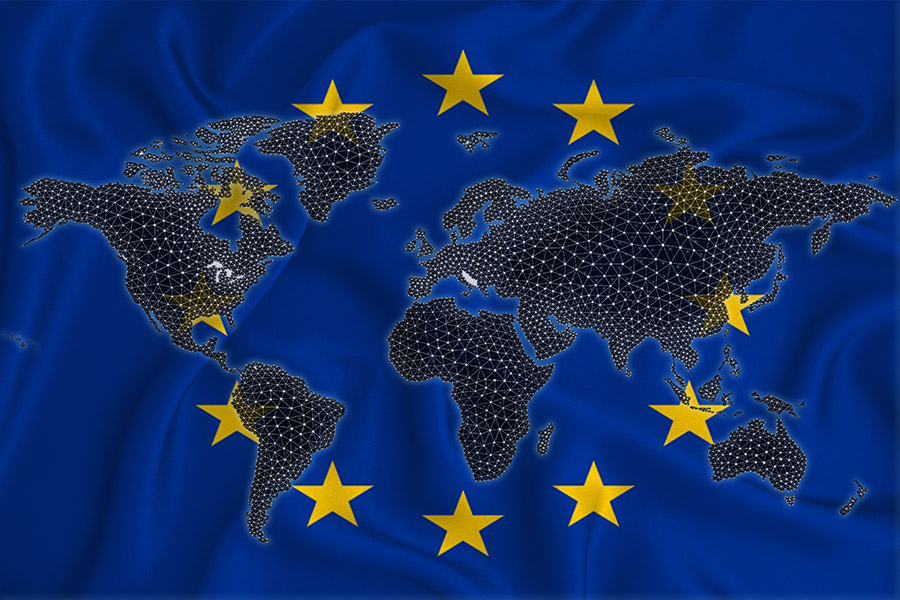 A stock photo depicting a map of the world with an overlay of the EU flag.