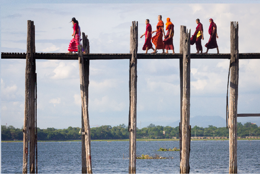 Monks crossing a bridge