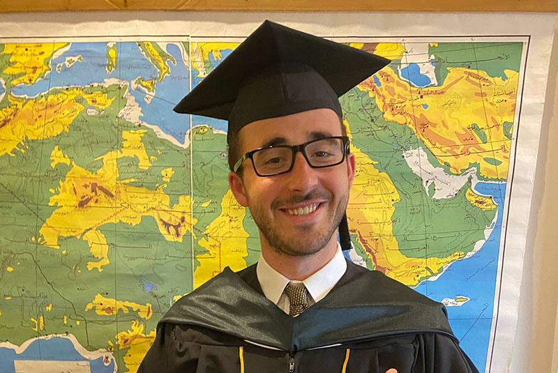 Johns Hopkins SAIS student in Commencement gown and cap